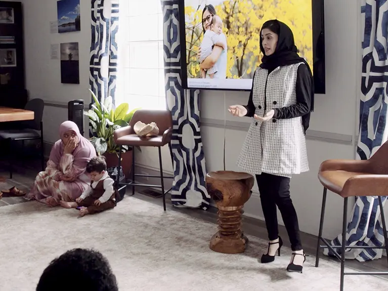 An Embrace Refugee Birth instructor leads a Moms Circle gathering.